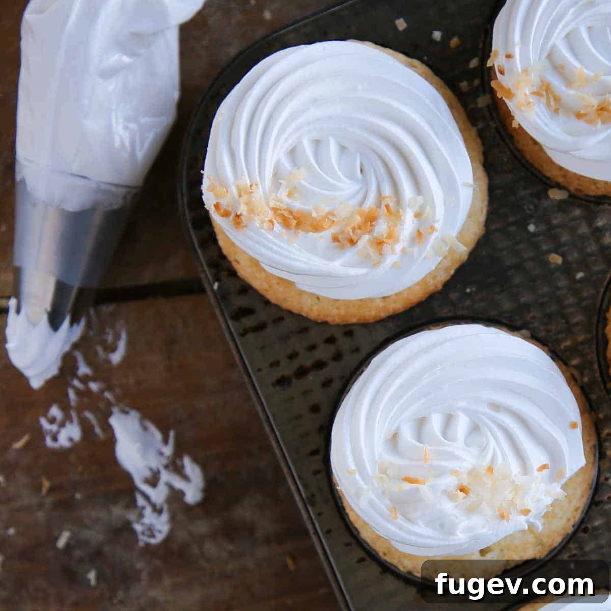 Pillowy Marshmallow Perfection 8 Piped marshmallow frosting arranged in elegant swirls, awaiting a final touch or serving.