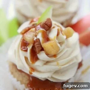 Apple Pie Cupcakes with Salted Caramel Buttercream by Life Made Sweeter. Apple spiced, stuffed with filling, topped with frosting and caramel drizzle.