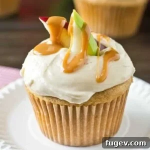 Caramel Apple Cupcakes by Taste of Lizzy T’s. Soft cupcakes flavored with apples and caramel in both the cupcake and the buttercream frosting.