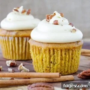 Toasted Pecan Pumpkin Cupcakes Maple Caramel Frosting. A soft, moist pumpkin cake is lightly spiced, topped with a brown sugar toasted pecan crumble prior to baking, filled with a pecan pie filling, and frosted with a brown sugar bourbon cream cheese frosting!