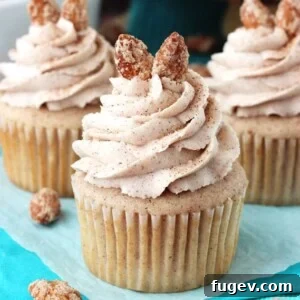 Cinnamon Sugar Almond Cupcakes by Life, Love and Sugar. Mouth-wateringly sweet, topped with nutty almonds. Yum!