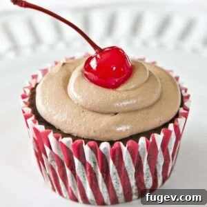 Chocolate Cherry Pie Cupcakes by Yellow Bliss Road. Sweet cherry pie filling combined with luscious dark chocolate cake mix, all topped with a decadent Chocolate Cream Cheese Frosting.