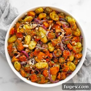 Roasted butternut squash sheet pan gnocchi in a bowl.
