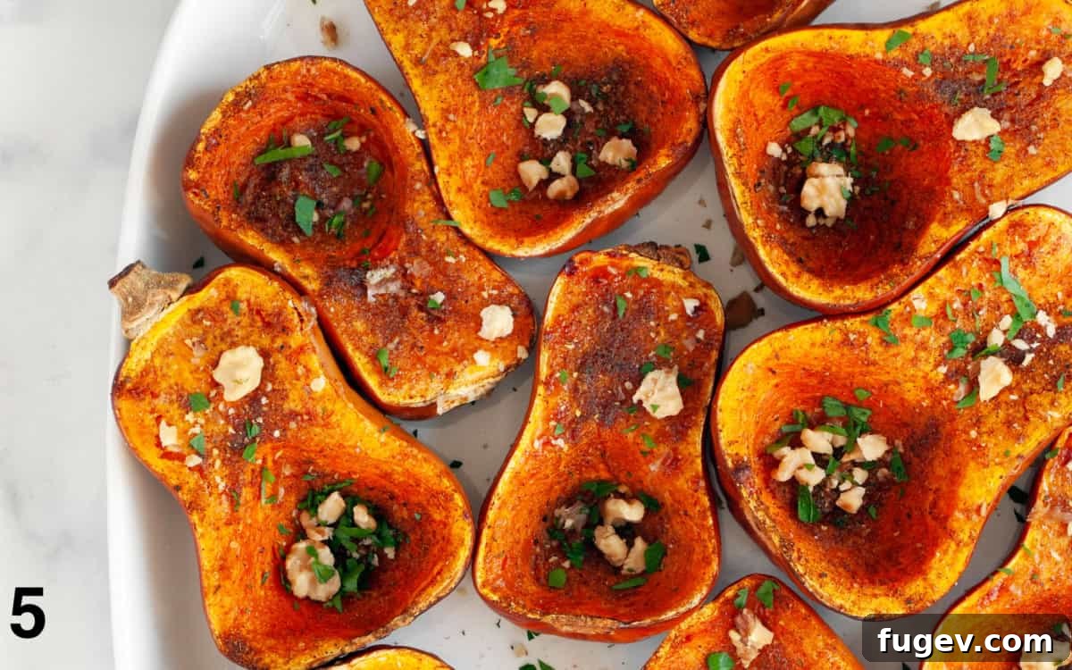Moroccan Golden Honeynut Roast 6 Roasted honeynut squash presented elegantly on a serving platter, beautifully garnished with fresh herbs and toasted walnuts.