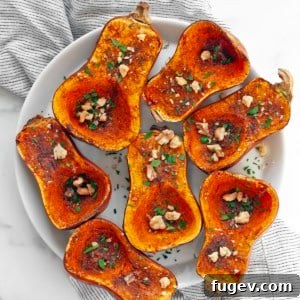 Moroccan-spiced roasted honeynut squash on a plate, ready to be served.