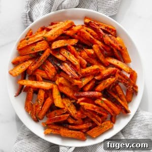 Roasted Carrots with Garlic and Parmesan 8 Roasted carrots on a plate.