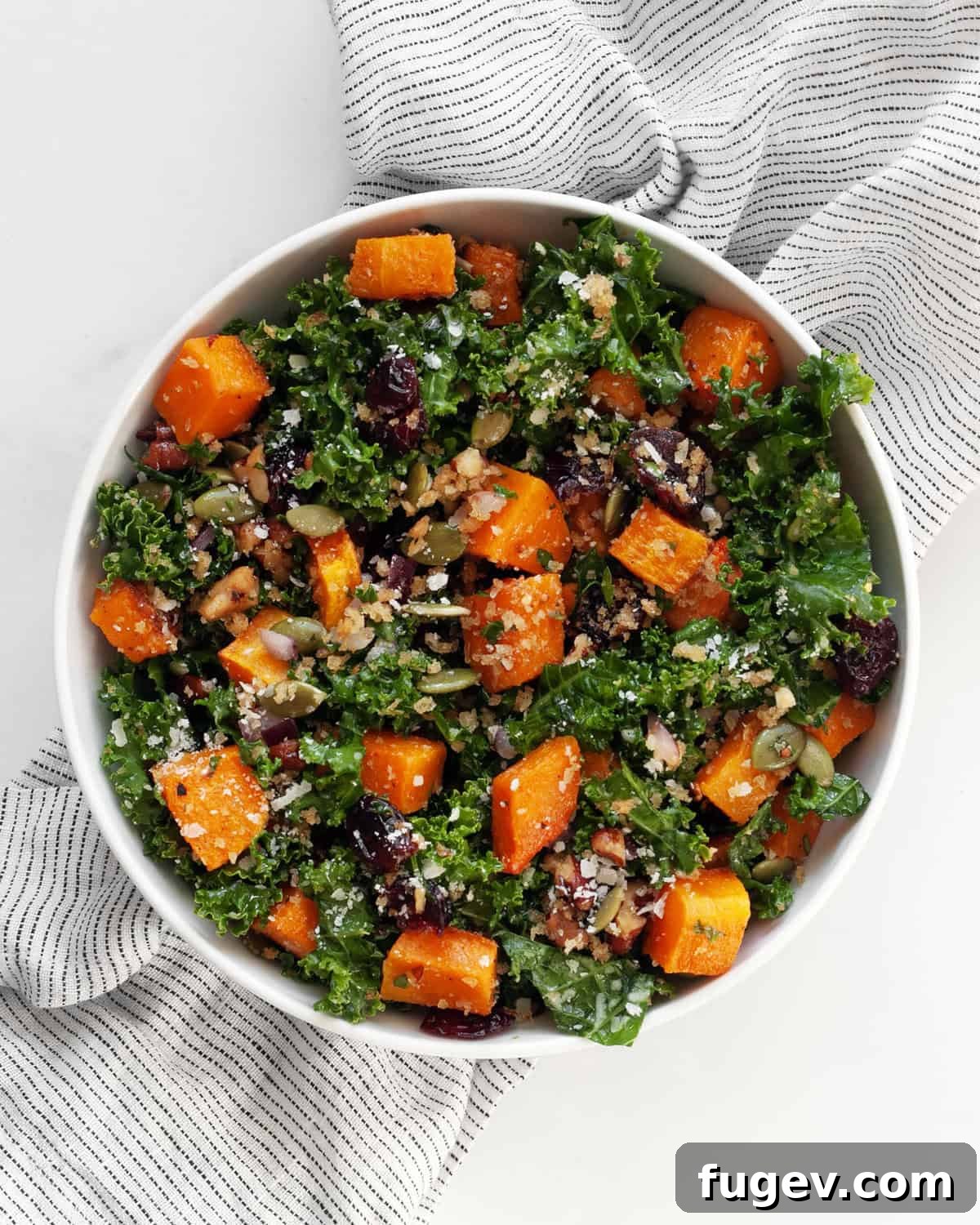 Harvest Roasted Butternut Squash Salad 8 A close-up shot of the finished butternut squash salad served elegantly in a white bowl, ready to be enjoyed.