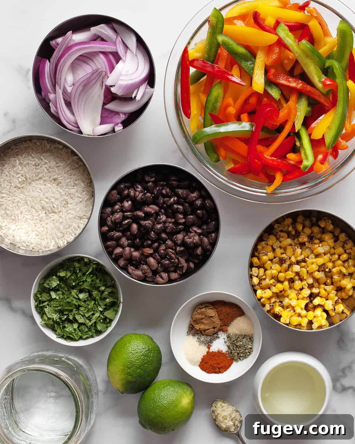 One-Pan Vibrant Veggie Fajita Bowls 3 Ingredients including peppers, onions, beans, corn, rice, lime, oil and spices.