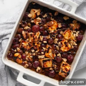 Golden Baked Feta with Honey-Kissed Grapes 7 Honey baked feta and grapes in a dish.