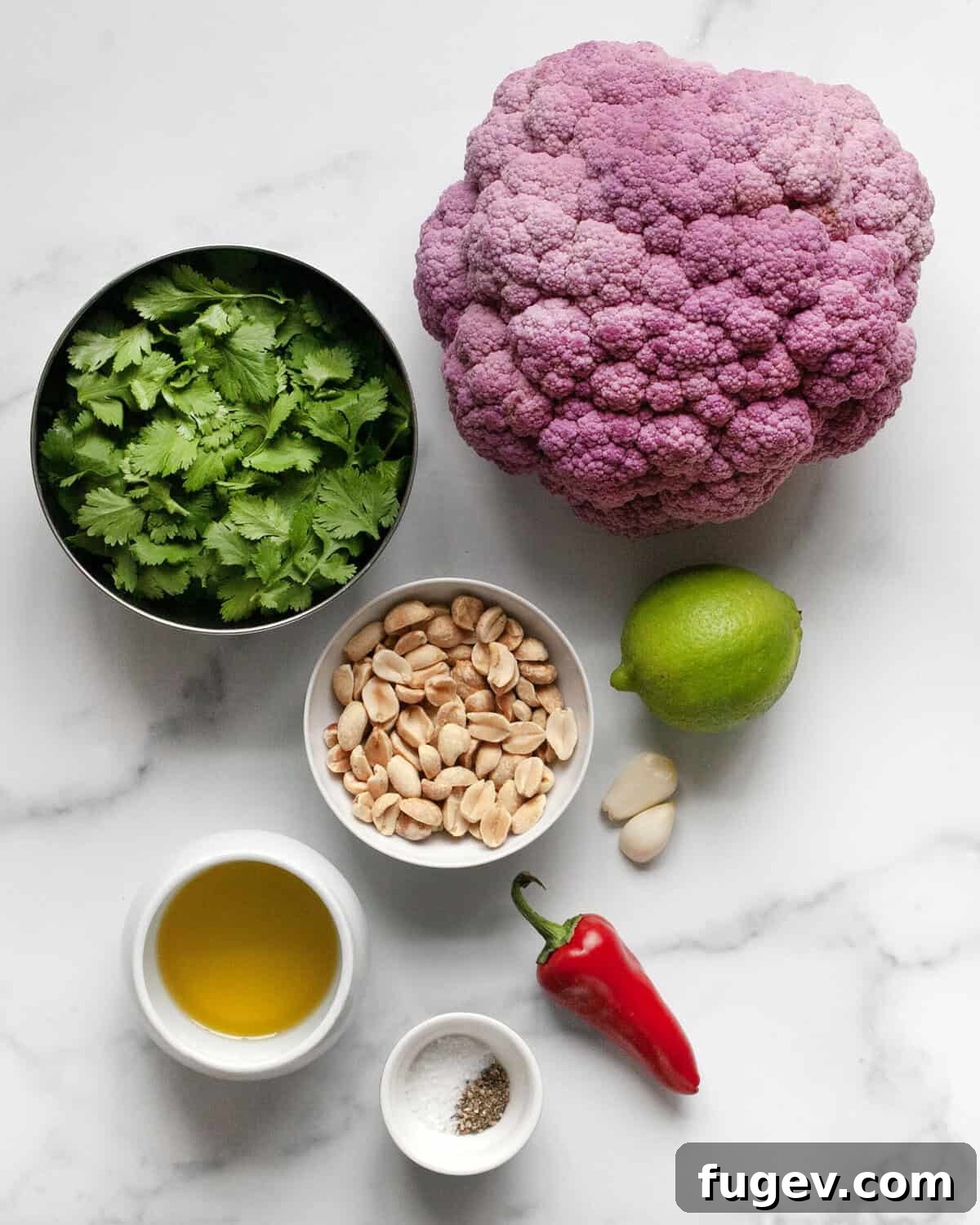 Roasted Amethyst Florets with Zesty Cilantro Burst 3 Ingredients for roasted purple cauliflower with cilantro pesto, including purple cauliflower head, olive oil, salt, pepper, garlic cloves, red chilies, lime, roasted peanuts, and fresh cilantro sprigs.