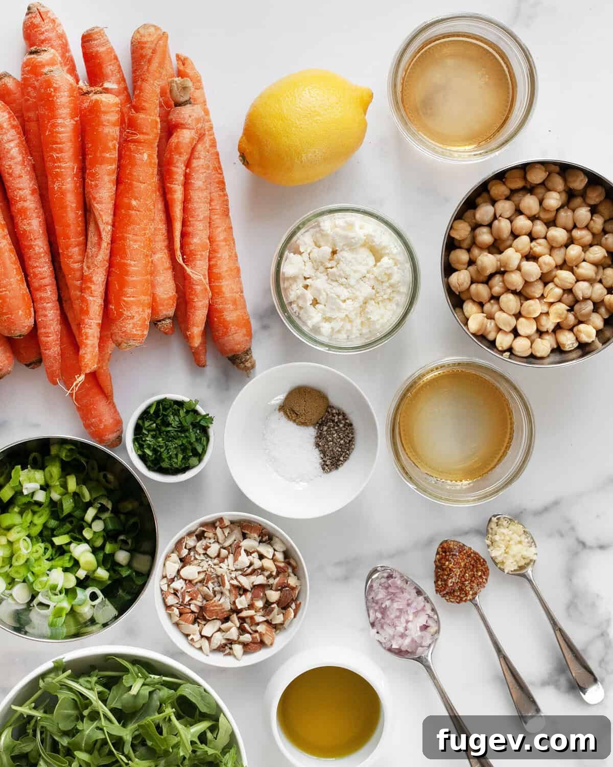Golden Roasted Carrot Salad 3 Ingredients including carrots, chickpeas, arugula, feta, scallions, parsley, olive oil, mustard, lemon, vinegar, garlic and spices.