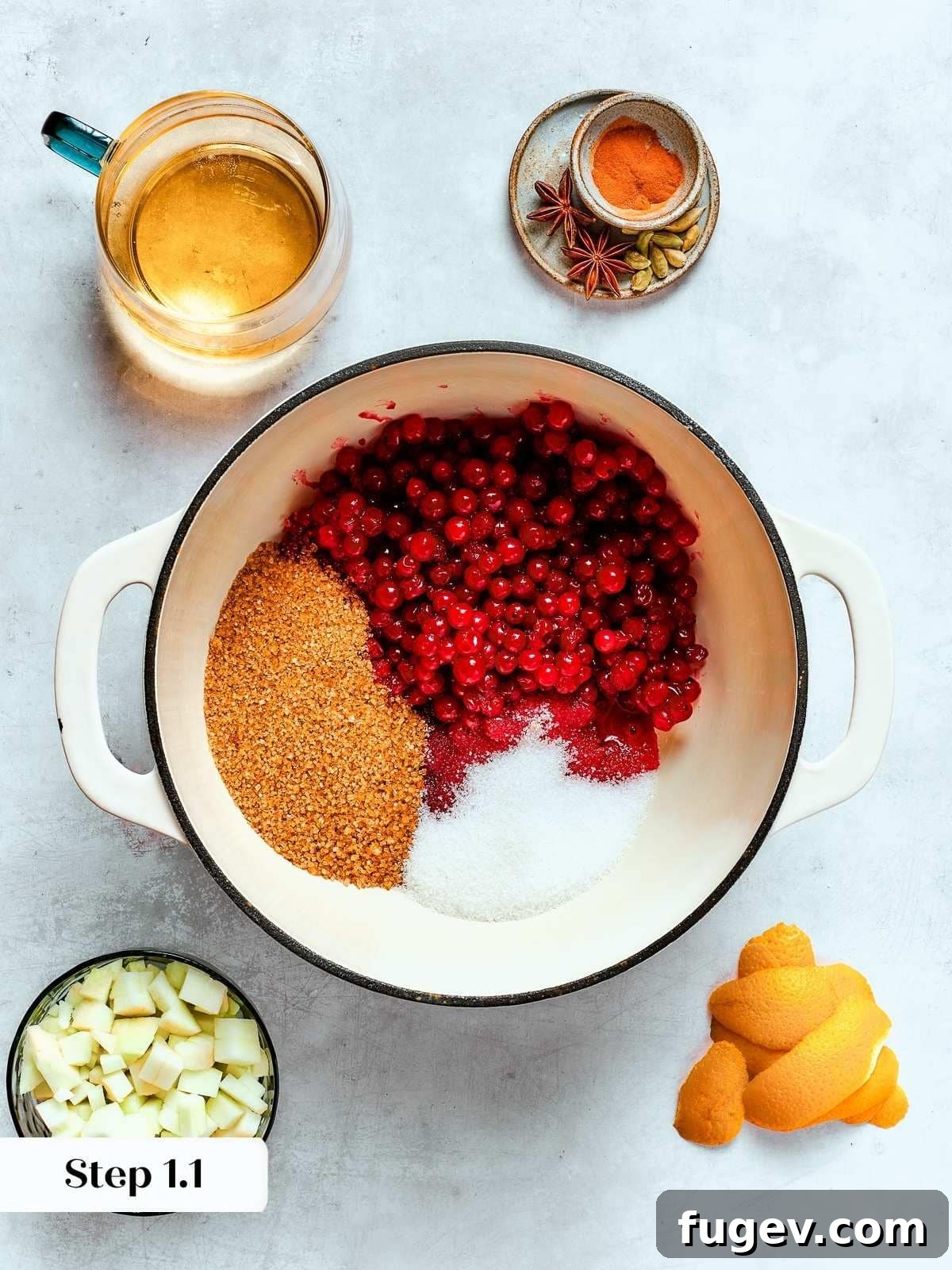 Holiday Cranberry Jewel 6 Fresh cranberries and a blend of brown and granulated sugars combined in a pot, ready to begin cooking into a thick, rich sauce.