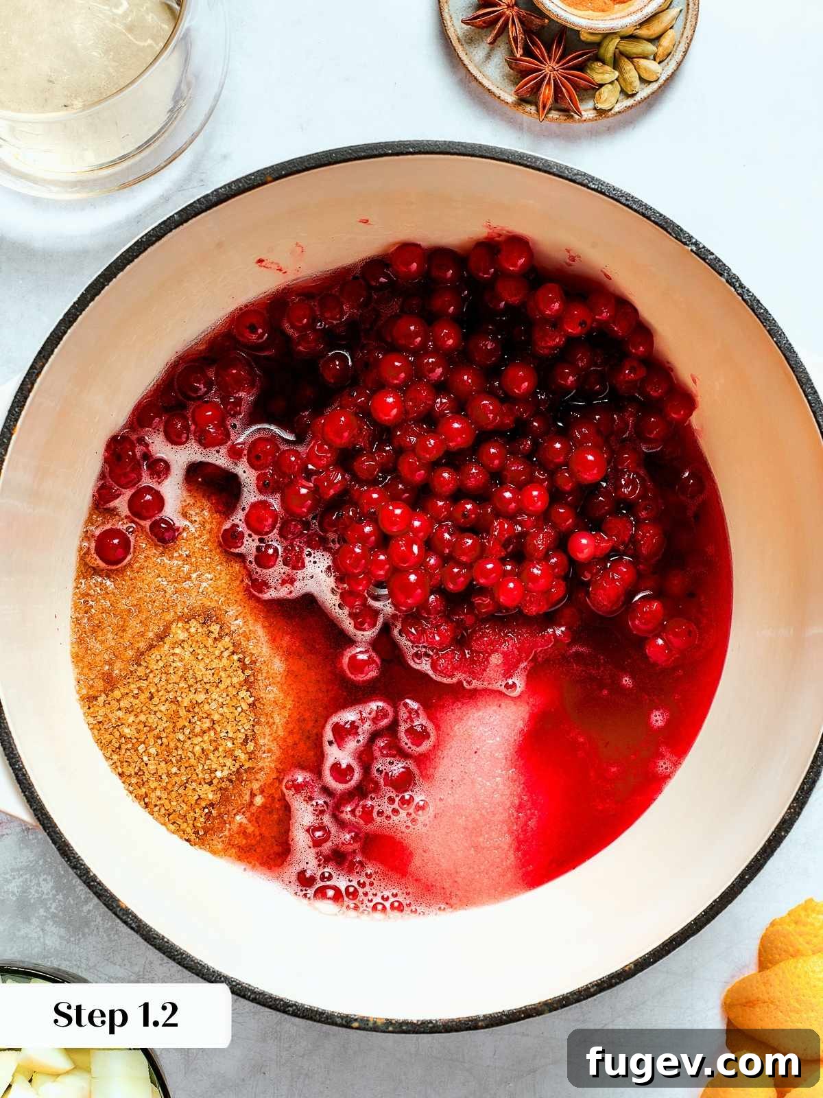 Holiday Cranberry Jewel 7 Cranberries, sugars, and apple cider bubbling gently together in a saucepan, beginning to release their juices and create a fragrant spiced sauce base.