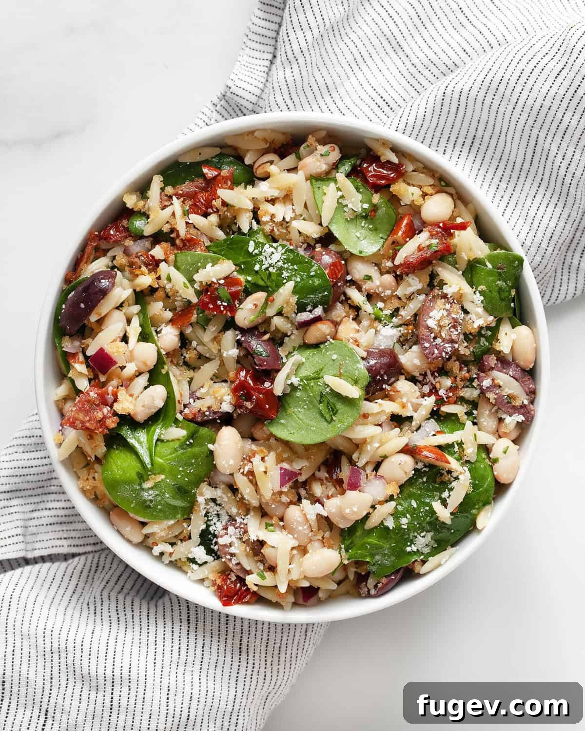 Lemony Orzo Delight 2 A beautifully presented lemon orzo salad in a rustic serving bowl, garnished with fresh herbs, ready to be enjoyed.