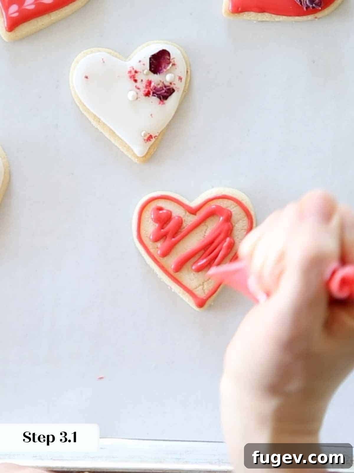 Cupid's Confections 12 A simple red royal icing squiggle created with a piping bag, demonstrating flooding technique.