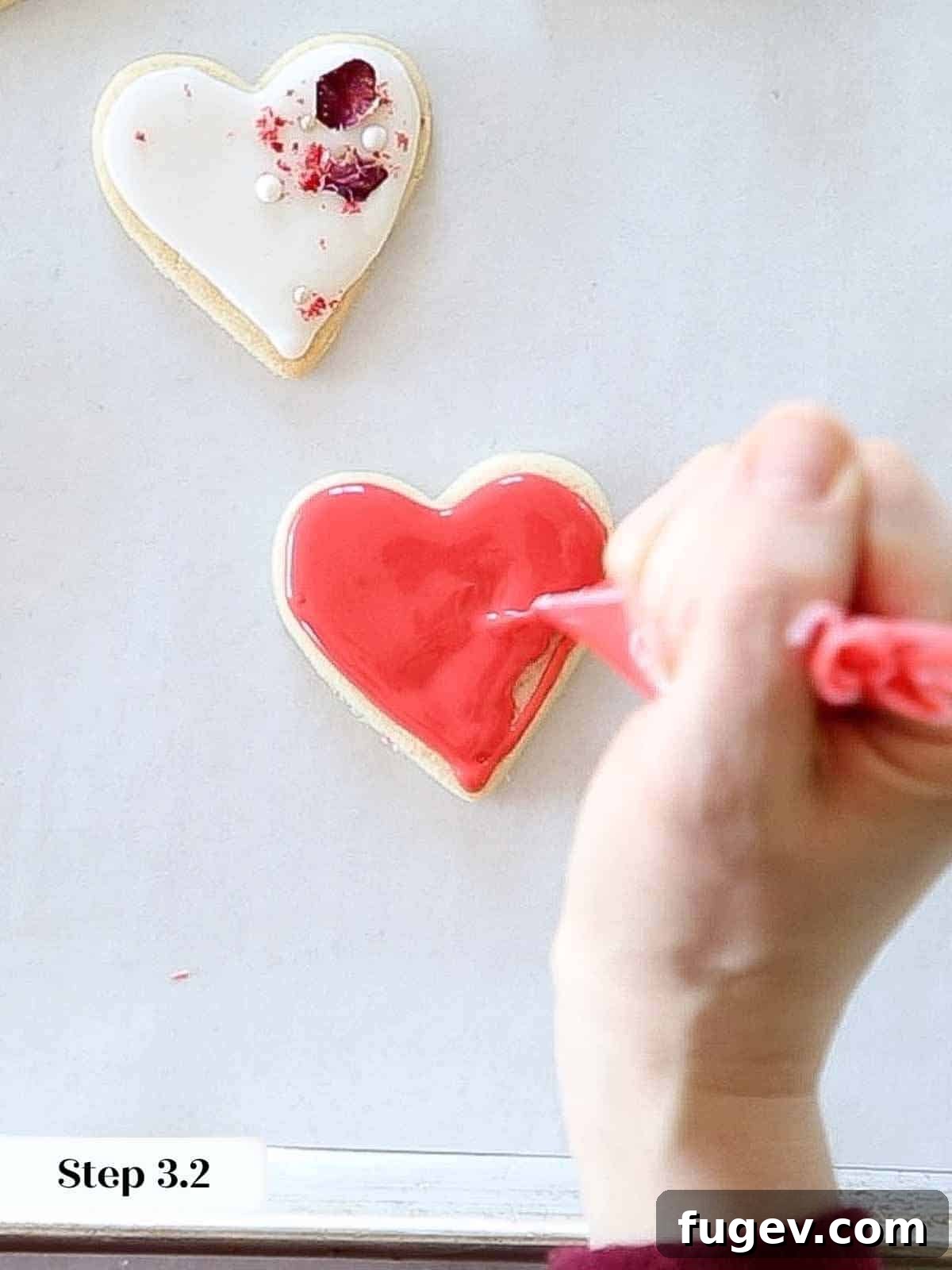Cupid's Confections 13 Flooding a heart-shaped sugar cookie with smooth, vibrant red royal icing.
