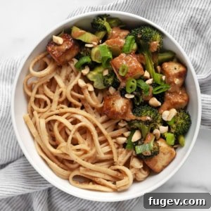 Roasted broccoli tofu bowl with peanut noodles.