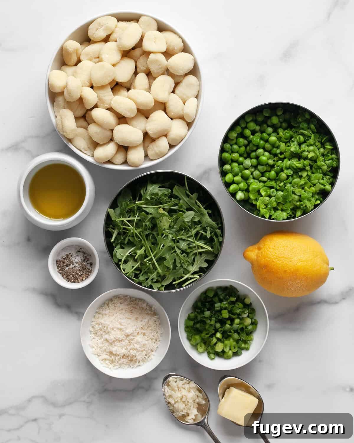 Golden Gnocchi with Bursting Spring Peas 3 Ingredients including gnocchi, peas, arugula, parmesan, scallions, garlic, lemon, olive oil, salt and pepper.