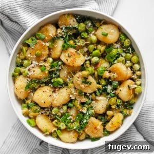 Crispy gnocchi with smashed peas in a bowl, ready to serve.