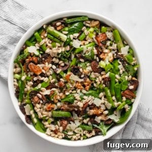 Roasted Asparagus Mushroom Barley Harvest Salad 9 A beautifully arranged bowl of roasted asparagus mushroom barley salad, ready to be served and enjoyed.