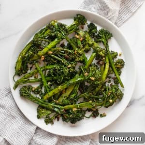 Roasted broccolini on a plate, garnished with gremolata.