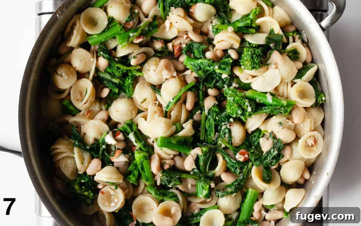 Zesty Lemon Rapini Pasta 7 Finished Lemon Rapini Pasta in a skillet, with all ingredients stirred in and ready to serve.