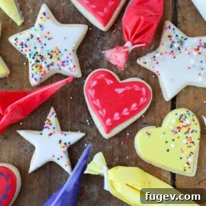 A heart-shaped cookie beautifully decorated with royal icing, showcasing the smooth texture and perfect finish.