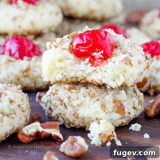 Ruby Cherry Delights 2 Soft, chewy cherry pecan cookies with cream cheese and almond extract, topped with maraschino cherries and rolled in pecans.
