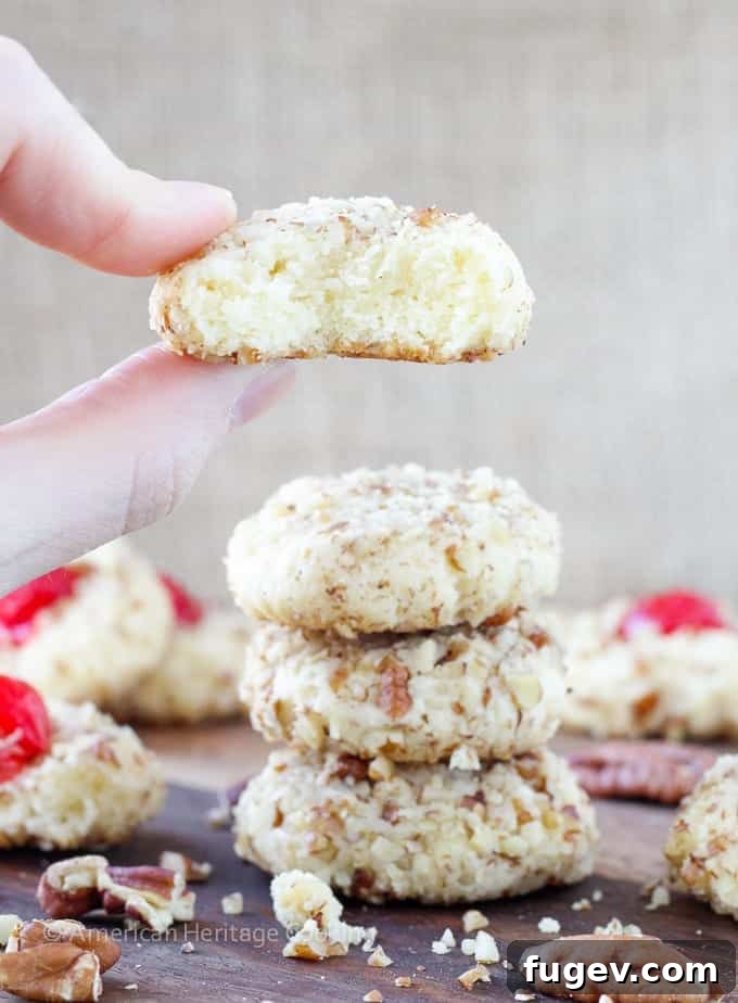 Ruby Cherry Delights 3 Close-up of baked cherry pecan cookies, showing their soft texture and crunchy pecan coating.