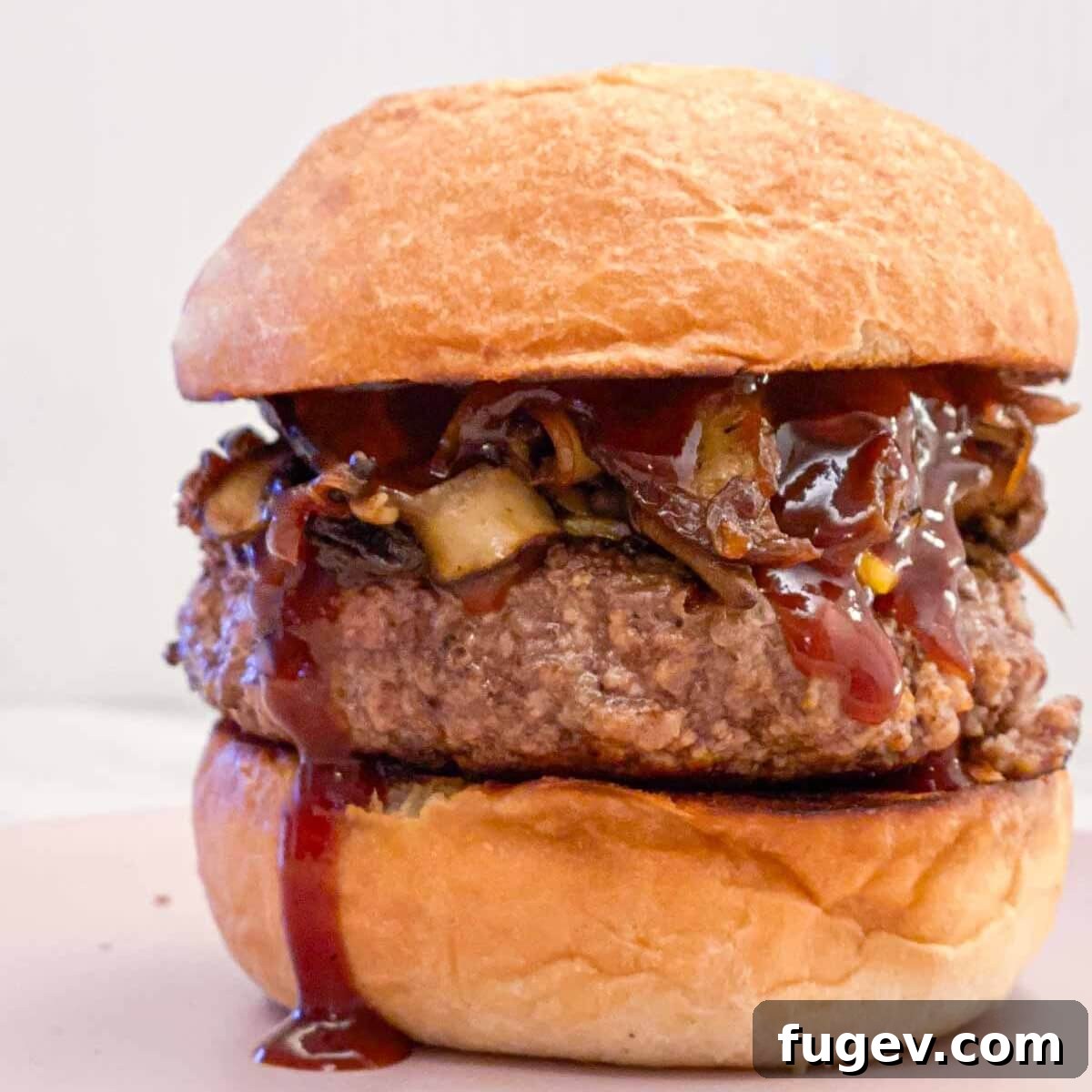 Simple Homemade BBQ Sauce 10 A gourmet burger with homemade BBQ sauce dripping tantalizingly.