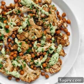 Roasted Cauliflower and Chickpeas with Herby Tahini sauce, a healthy and flavorful side dish.
