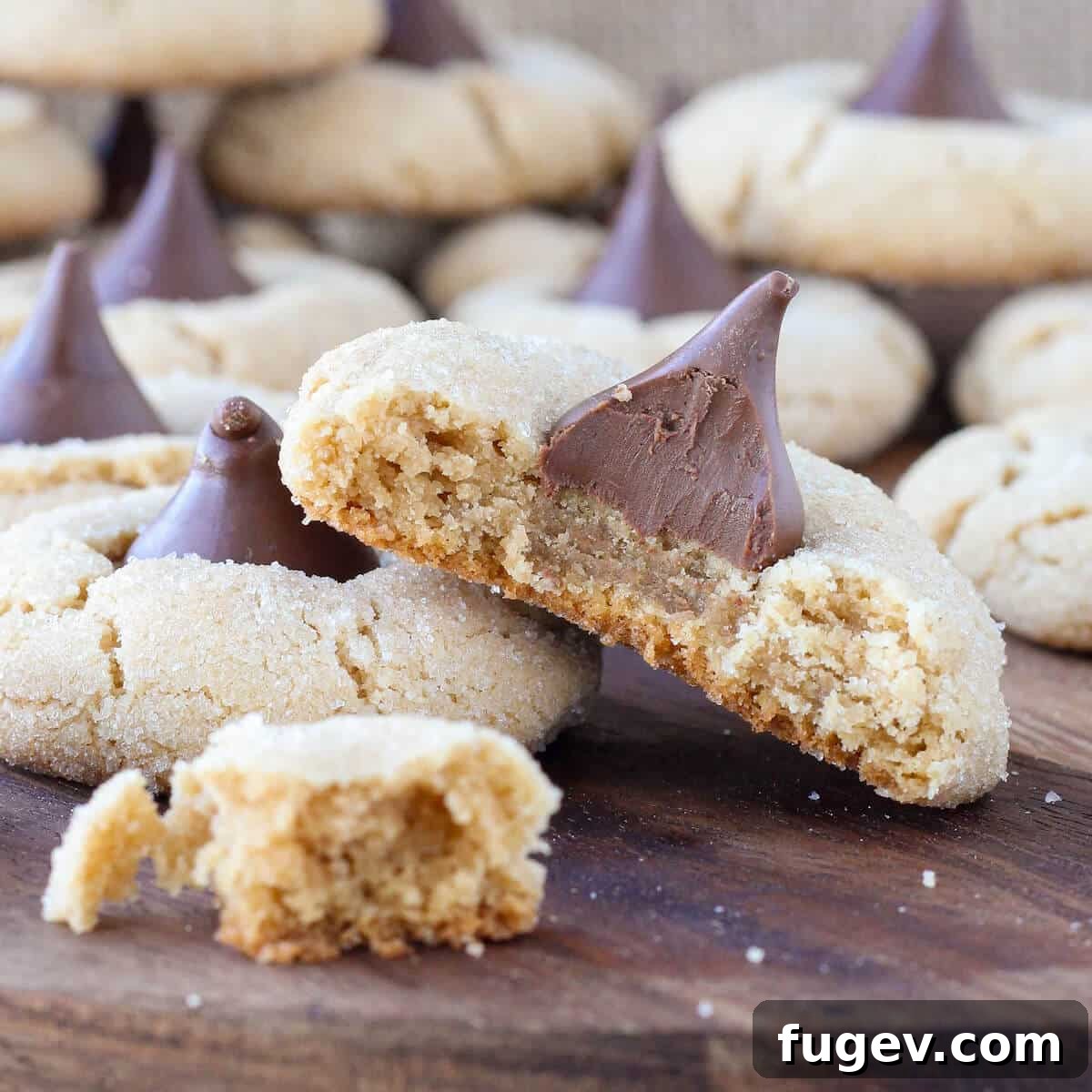 Peanut Butter Dream Drops 2 Peanut Butter Blossoms broken open to reveal soft interior and melted chocolate
