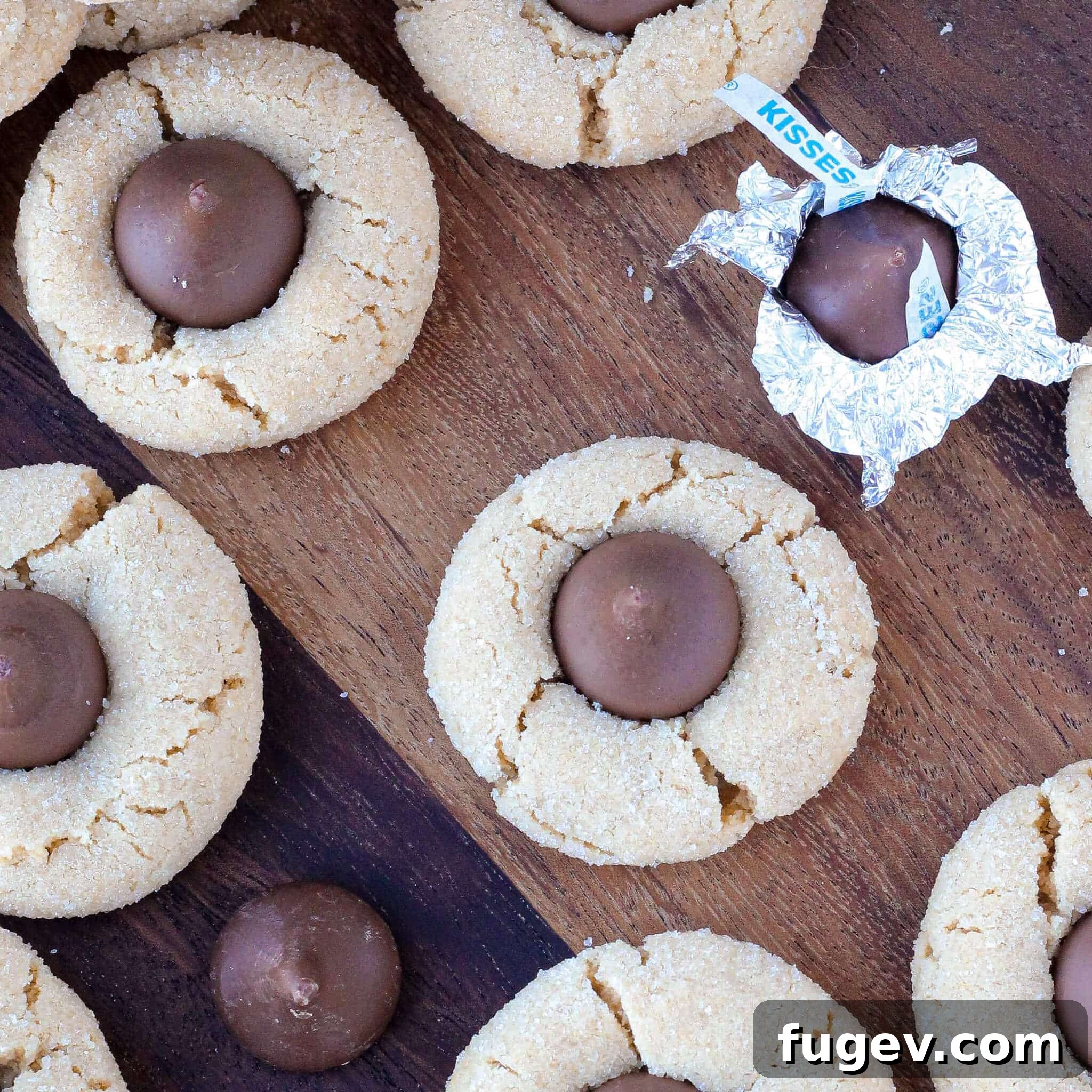 Peanut Butter Dream Drops 8 Peanut Butter Blossoms artfully arranged on a rustic wooden surface