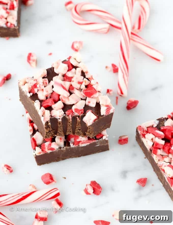 Effortless Dark Chocolate Peppermint Fudge Delight 3 Close-up of a perfectly cut square of Dark Chocolate Peppermint Fudge, showcasing its smooth texture and peppermint topping.
