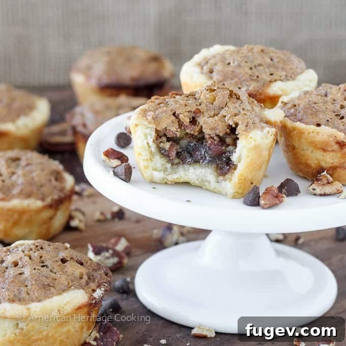 Decadent Chocolate Pecan Bites 4 A stack of Chocolate Pecan Tassies, showcasing the flaky crust and pecan-chocolate filling, ready to be enjoyed.