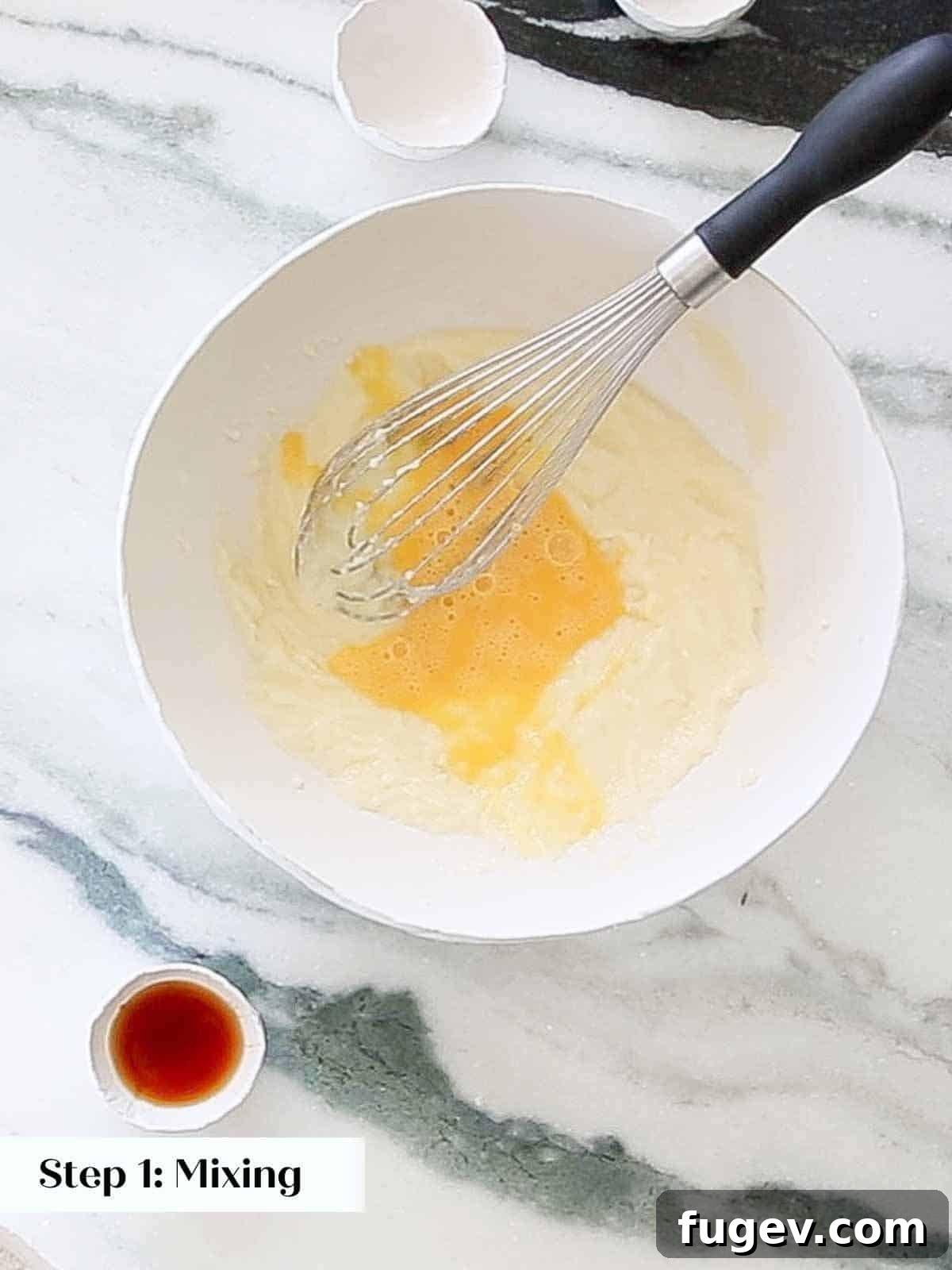 Melt-in-Your-Mouth Sugar Cookies 6 Whisking eggs into melted butter and sugar mixture.