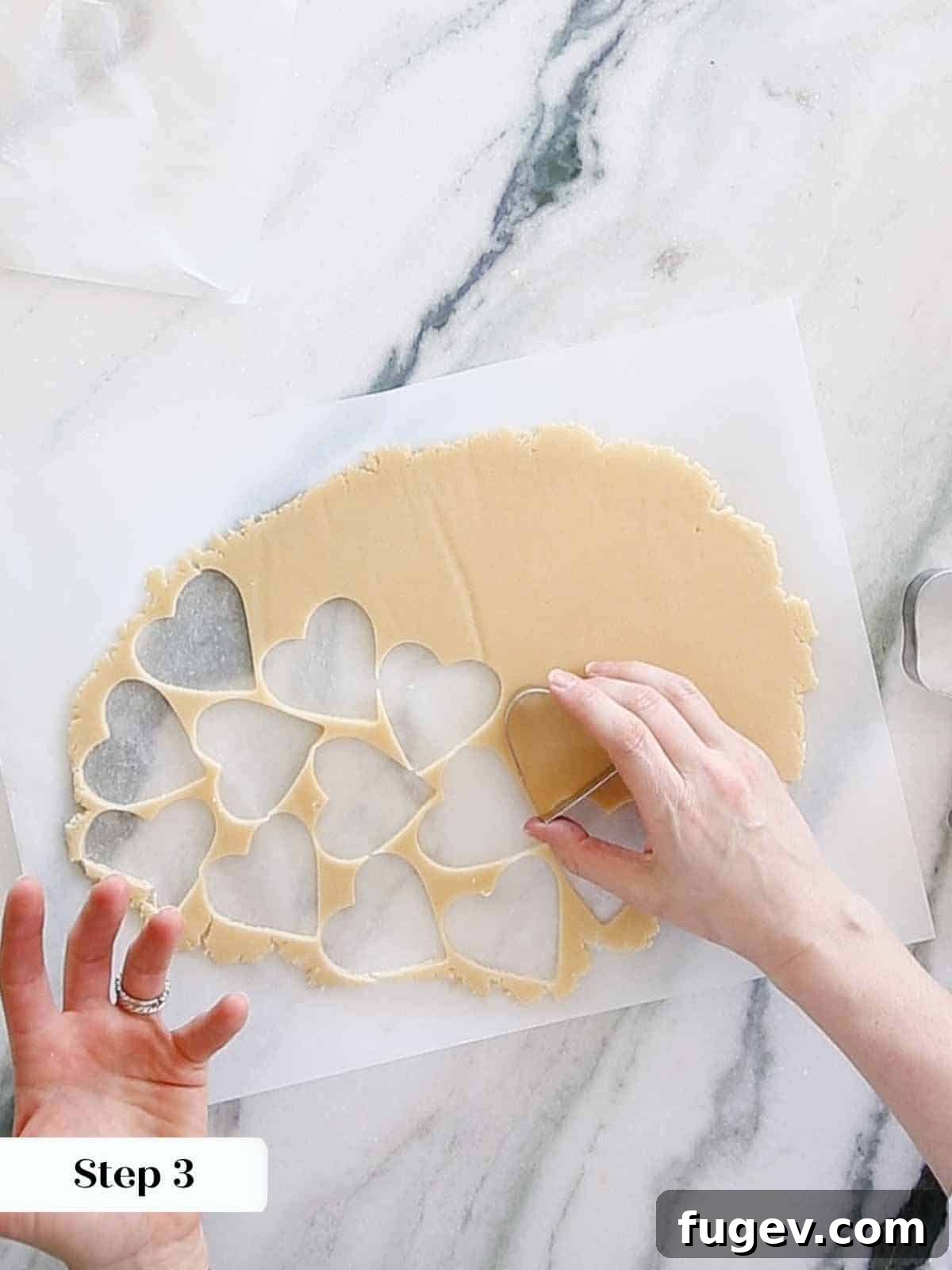 Melt-in-Your-Mouth Sugar Cookies 10 Cutting heart shapes from sugar cookie dough.
