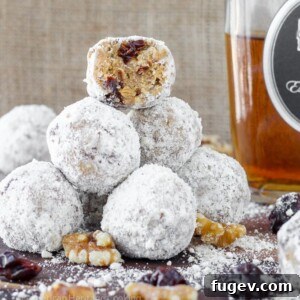 Spiced Gingersnap Brandy Bites 2 A plate of freshly made No-Bake Gingersnap Brandy Balls, dusted with powdered sugar.