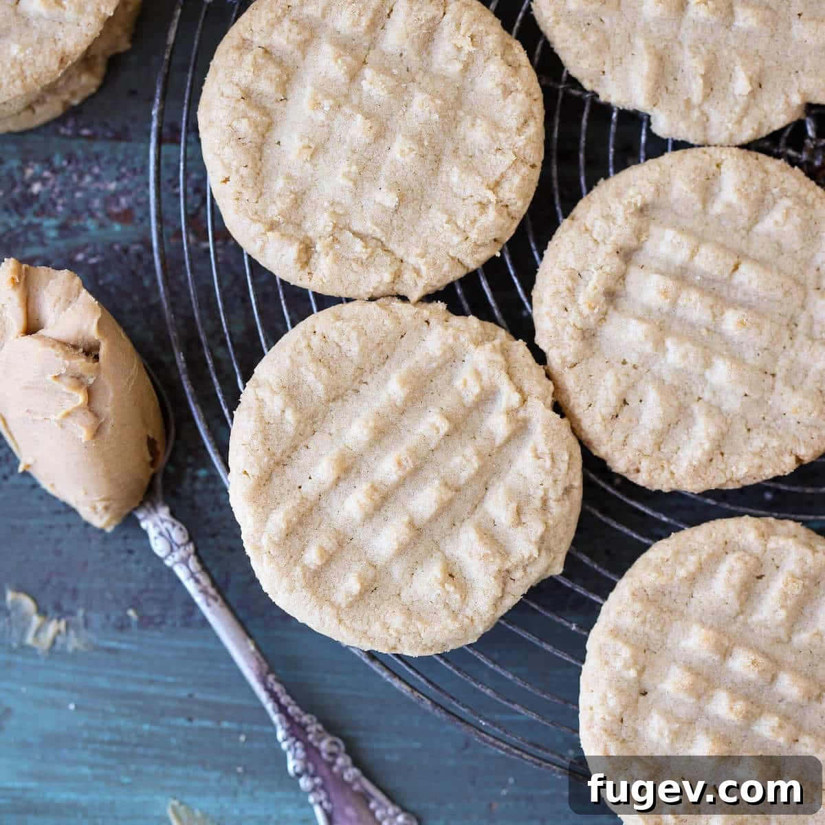 25 Deliciously Simple Christmas Cookies 6 Old Fashioned Peanut Butter Cookies on cooling rack.