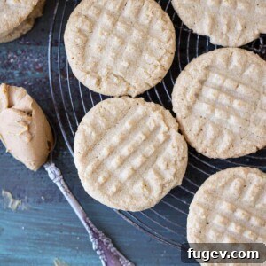 Old Fashioned Peanut Butter Cookies on cooling rack with perfect fork tine impressions.