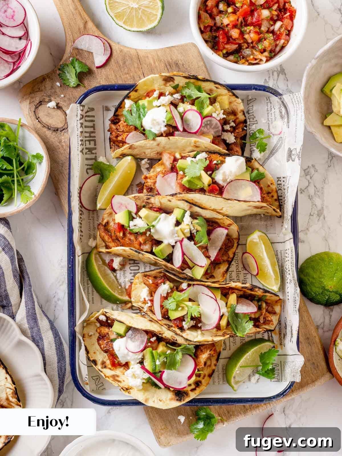 Fiesta Chicken Tacos 13 Platter of freshly assembled chicken tacos with fresh ingredients.