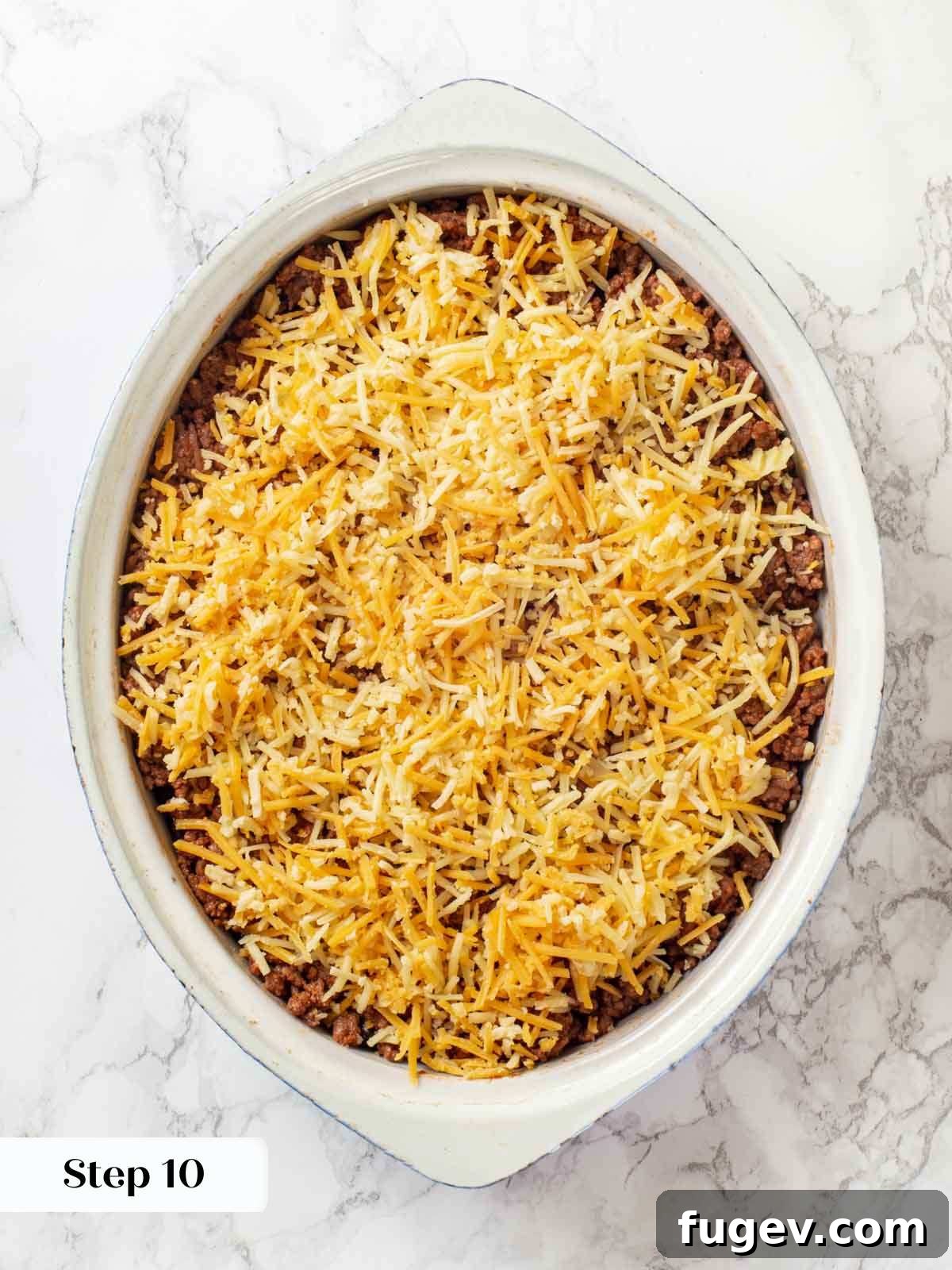 Cheesy Taco Bake 12 The fully layered, unbaked taco casserole, ready for the oven.