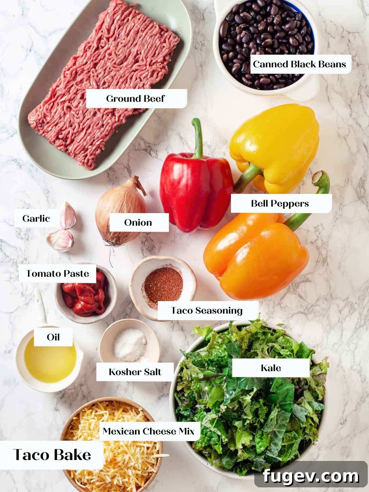 Cheesy Taco Bake 5 Main taco bake ingredients including bell peppers, kale, and cheese on a marble surface.