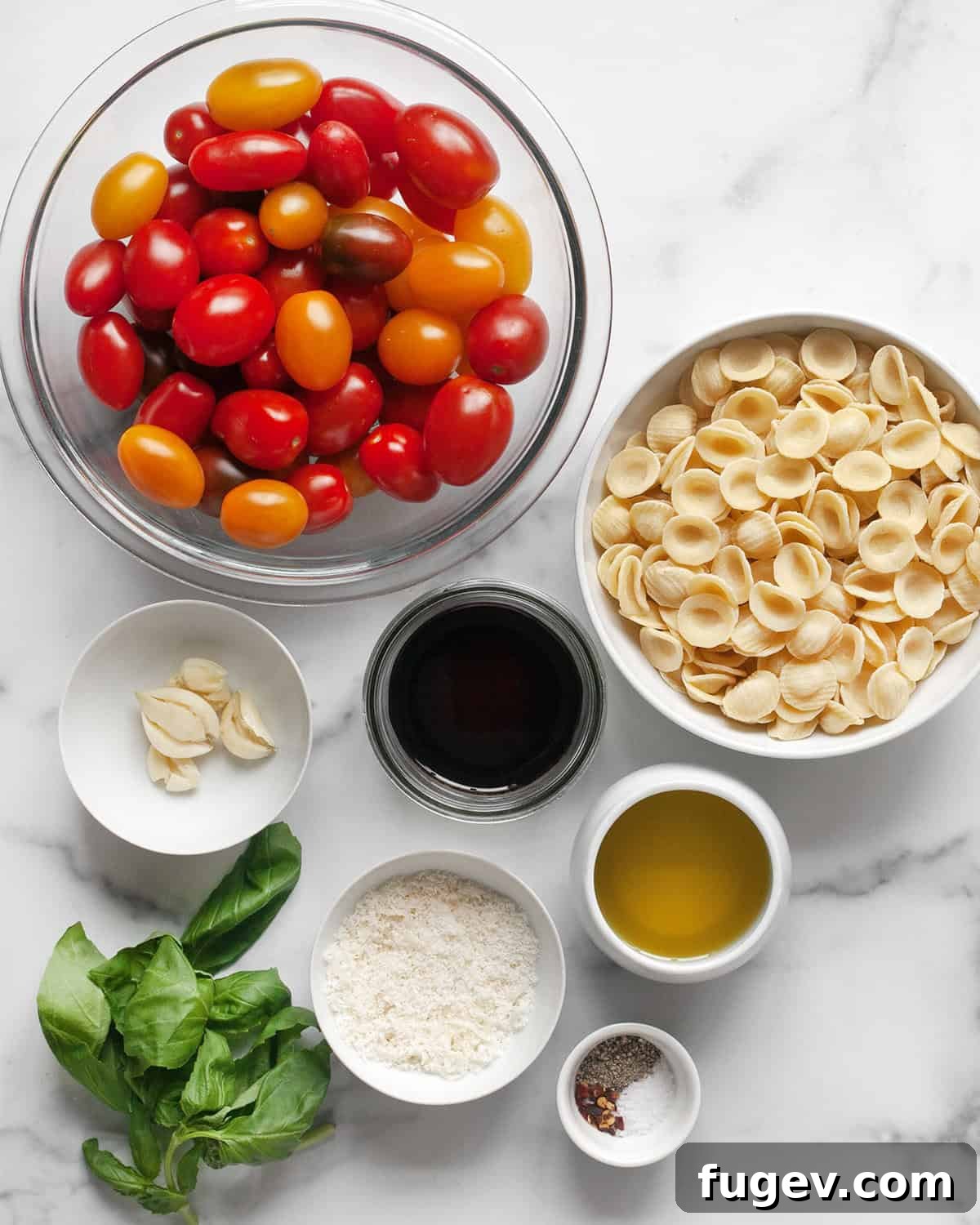 Rustic Roasted Tomato Pasta 3 Ingredients for roasted tomato pasta including cherry tomatoes, olive oil, garlic, orecchiette, balsamic vinegar, parmesan, basil, and seasonings.