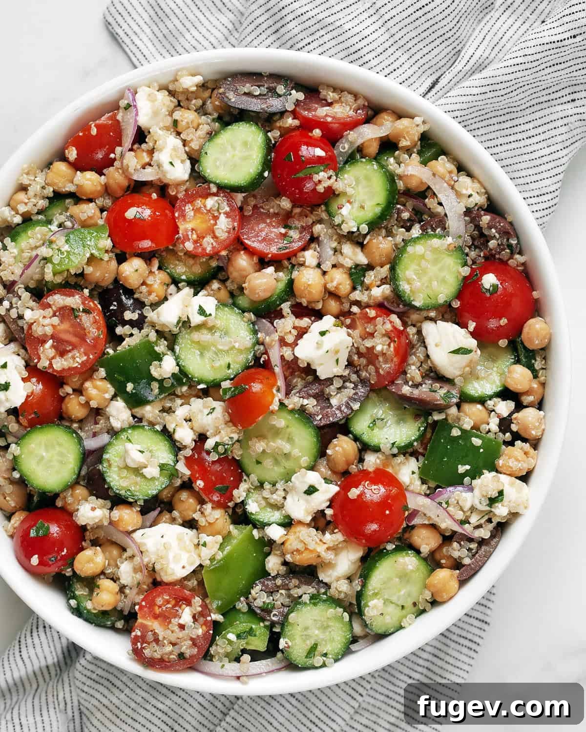 Vibrant Greek Quinoa Medley 2 A vibrant bowl of Greek quinoa salad, showcasing fresh vegetables, feta, and quinoa.