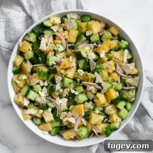 Pineapple cucumber salad in a bowl.