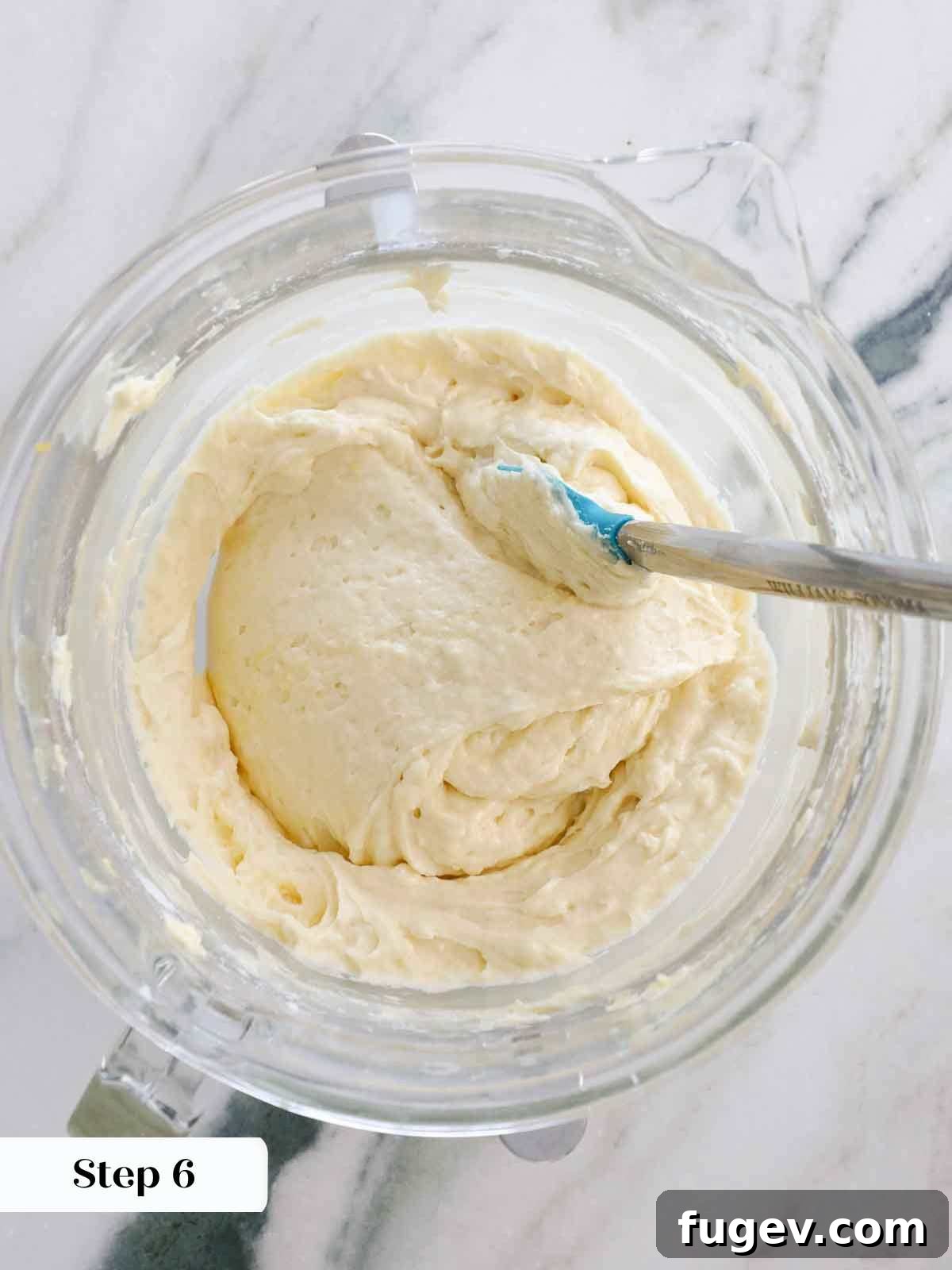 Zesty Lemon Delights 11 finished lemon cupcake batter in clear mixing bowl.