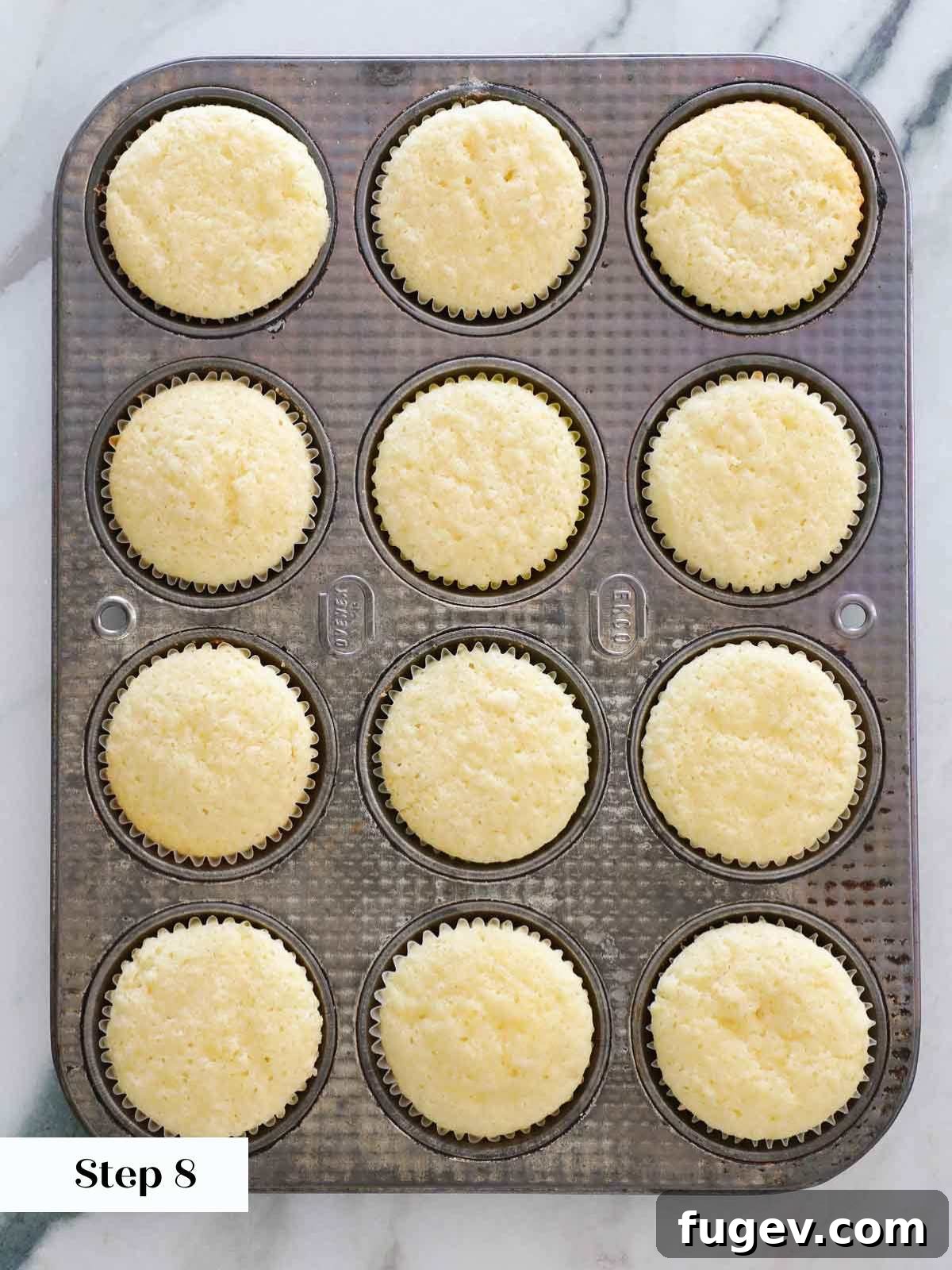 Zesty Lemon Delights 13 baked lemon cupcakes in tin.