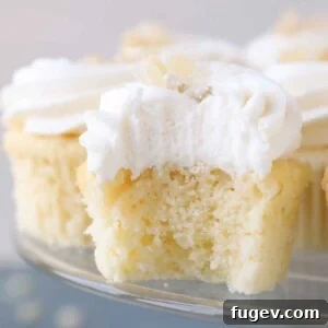 interior texture of lemon cupcake with lemon buttercream.