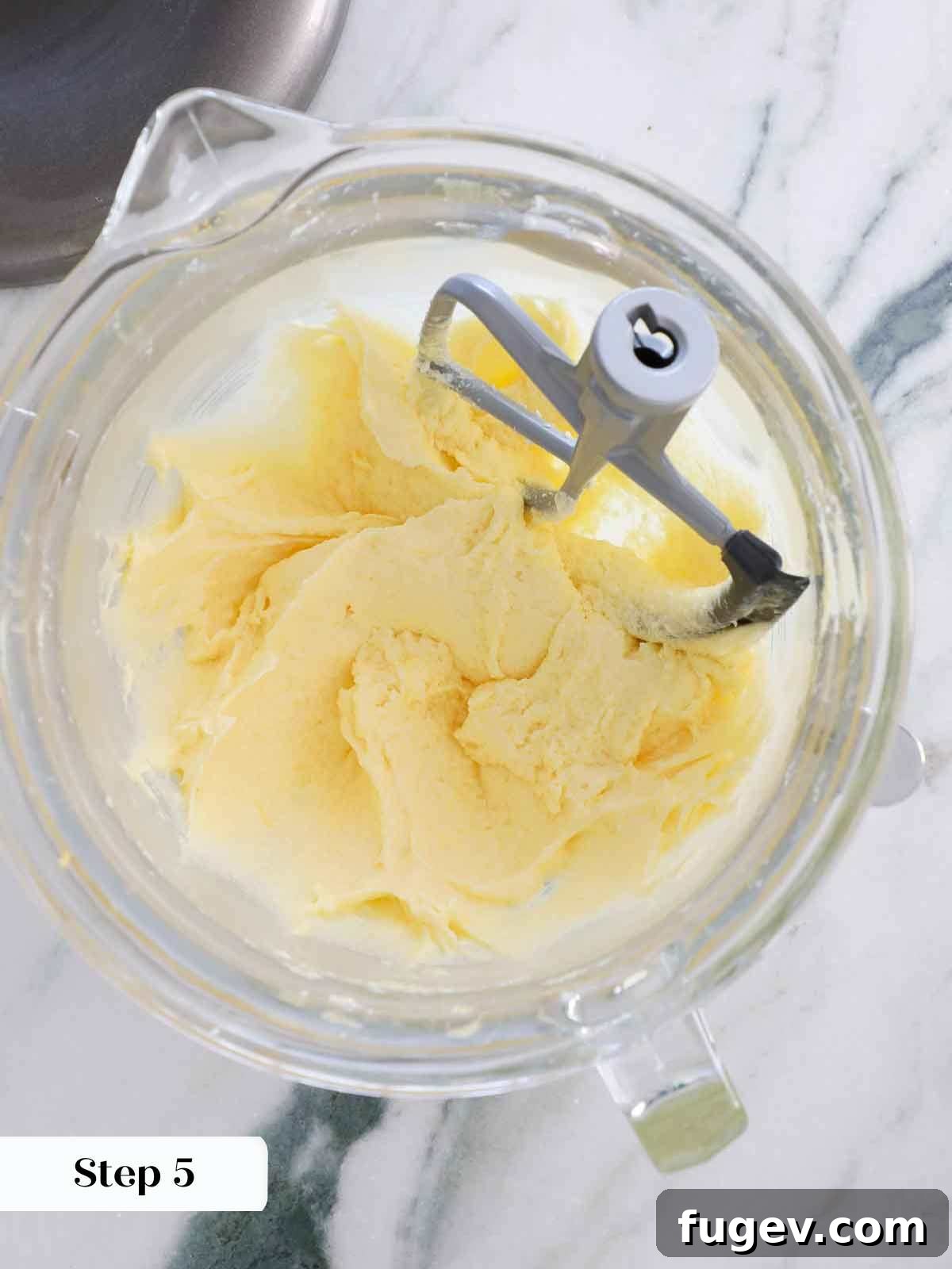 Zesty Lemon Delights 10 creamed batter after adding eggs for lemon cake.